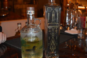 The craft distillery's two products: Loonshine Whiskey and Metropoligin 